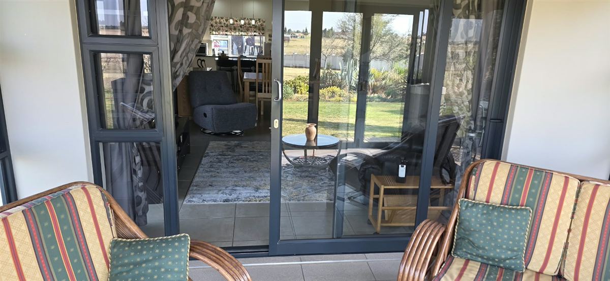 Grey aluminium sliding patio doors at a residential property